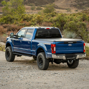 Blue Ford F250 Super Duty fitted with a Mountain Top EVO-M retractable truck bed cover
