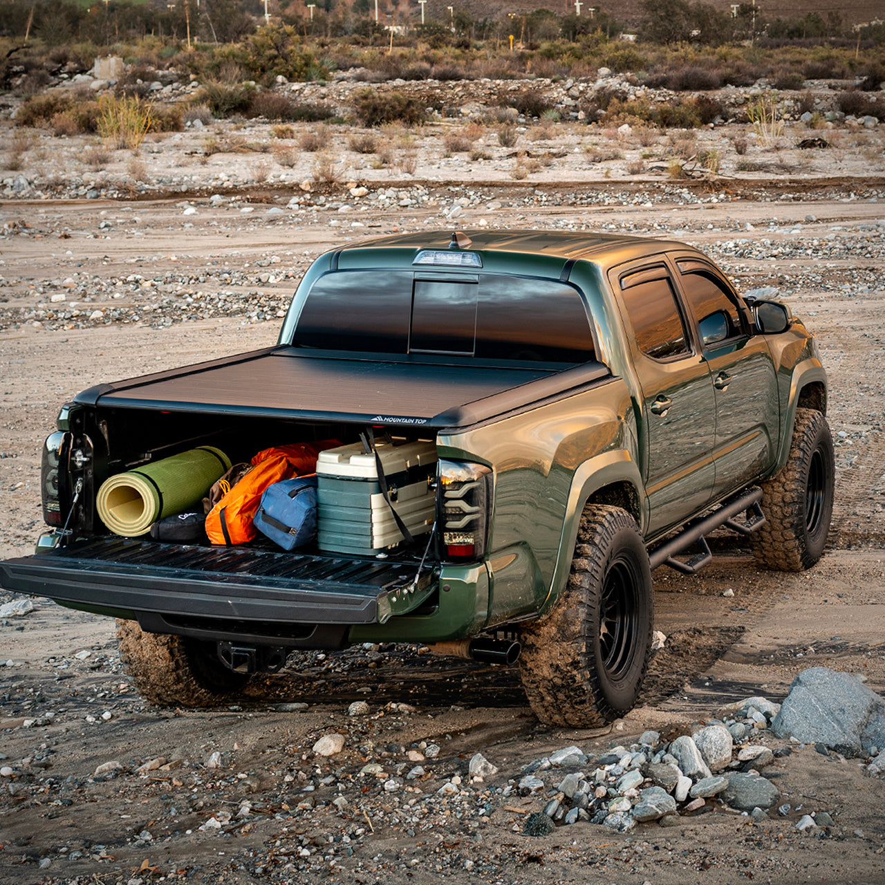 Green Tacoma with Mountain Top Retractable Tonneau Truck Bed Cover